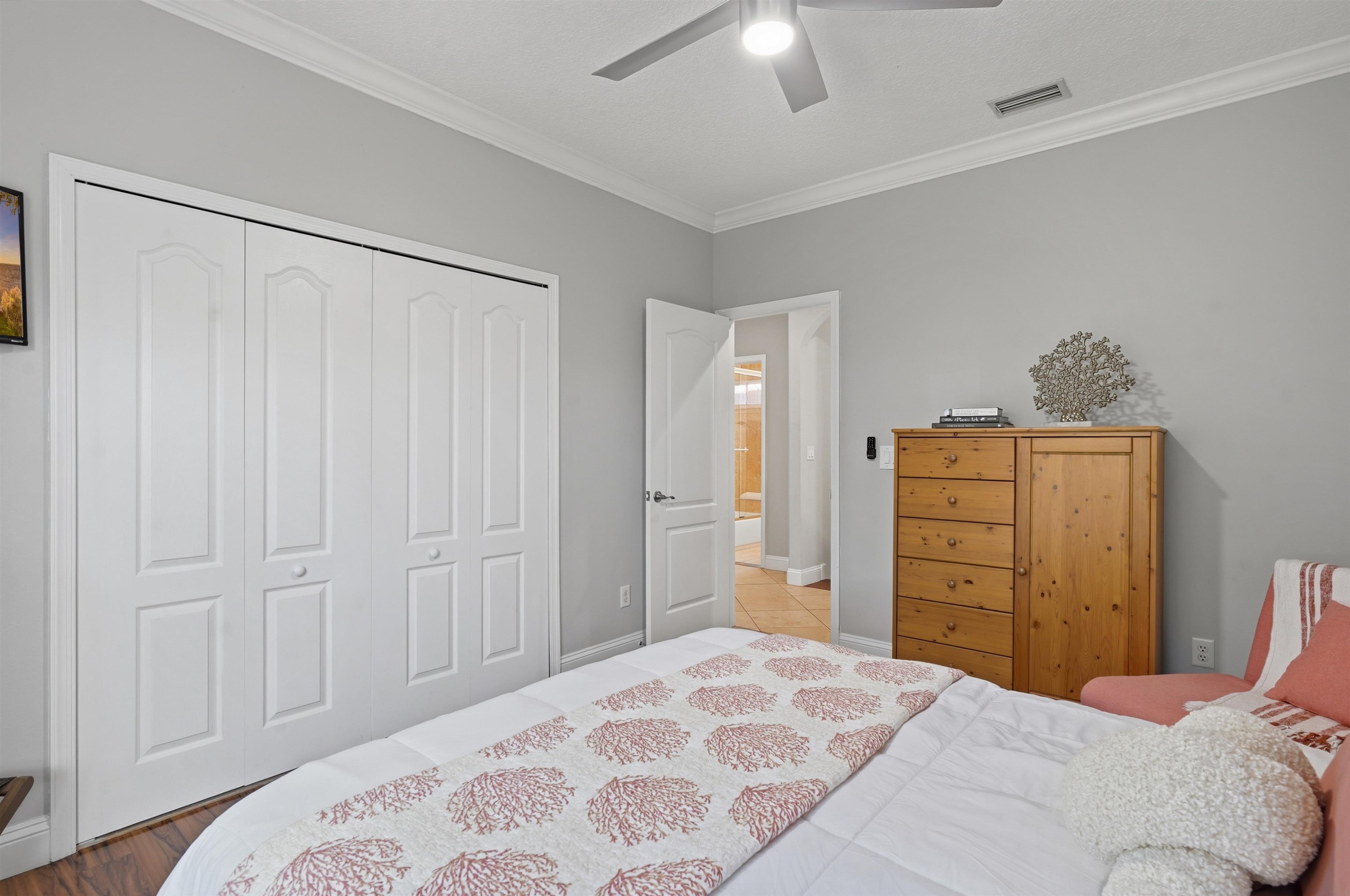 2 Lisbon Street St. Augustine, FL 32080 - Photo 22 of 39 a bedroom with a bed and a closet