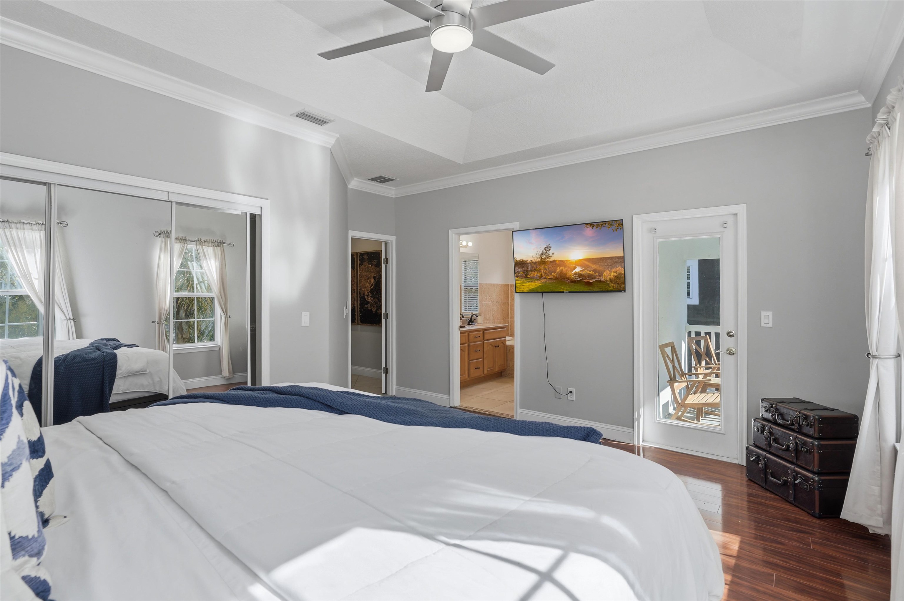 2 Lisbon Street St. Augustine, FL 32080 - Photo 24 of 39 a bedroom with a large bed and a chandelier