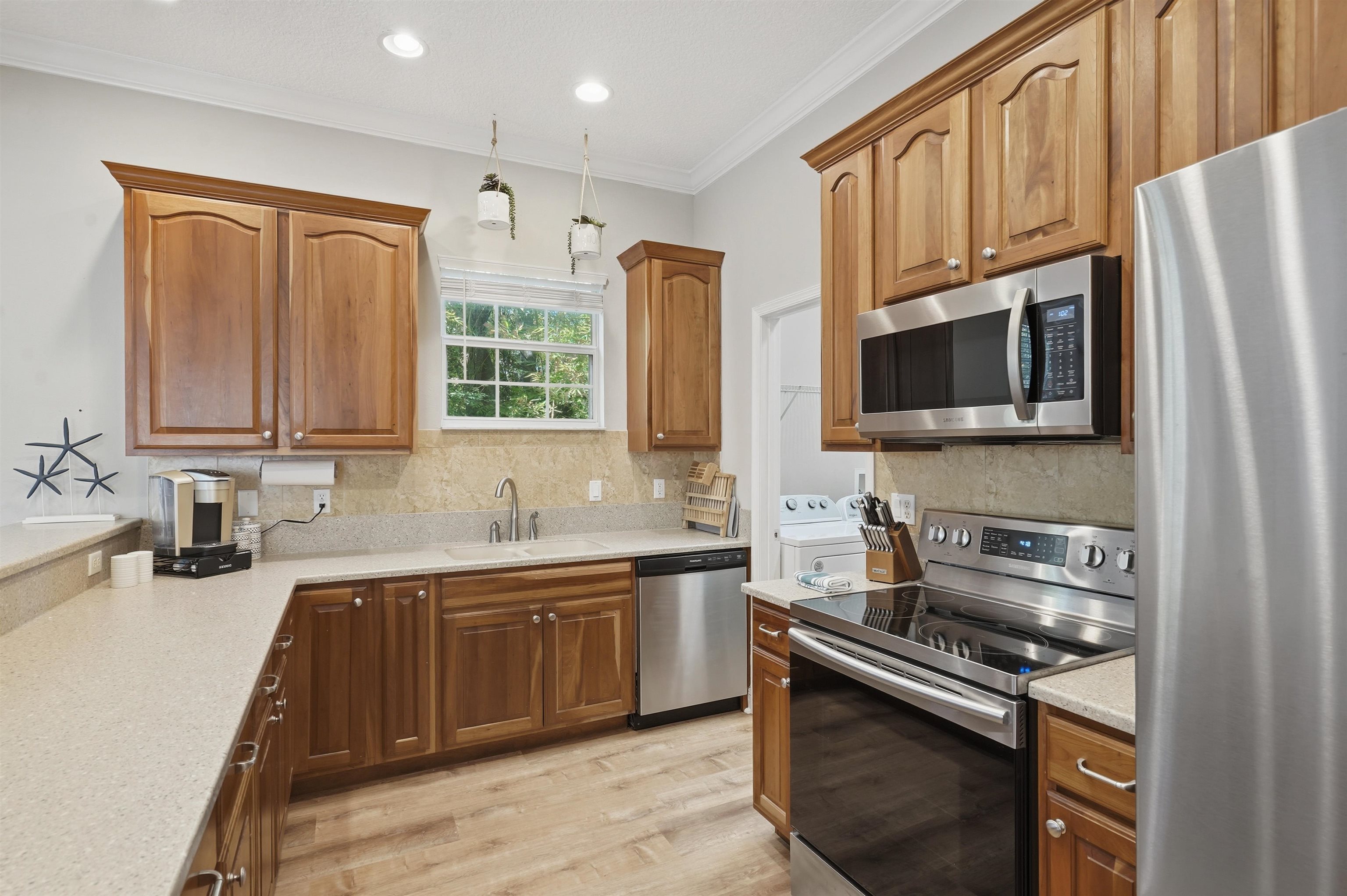 2 Lisbon Street St. Augustine, FL 32080 - Photo 3 of 39 a kitchen with stainless steel appliances granite countertop a stove sink microwave and refrigerator