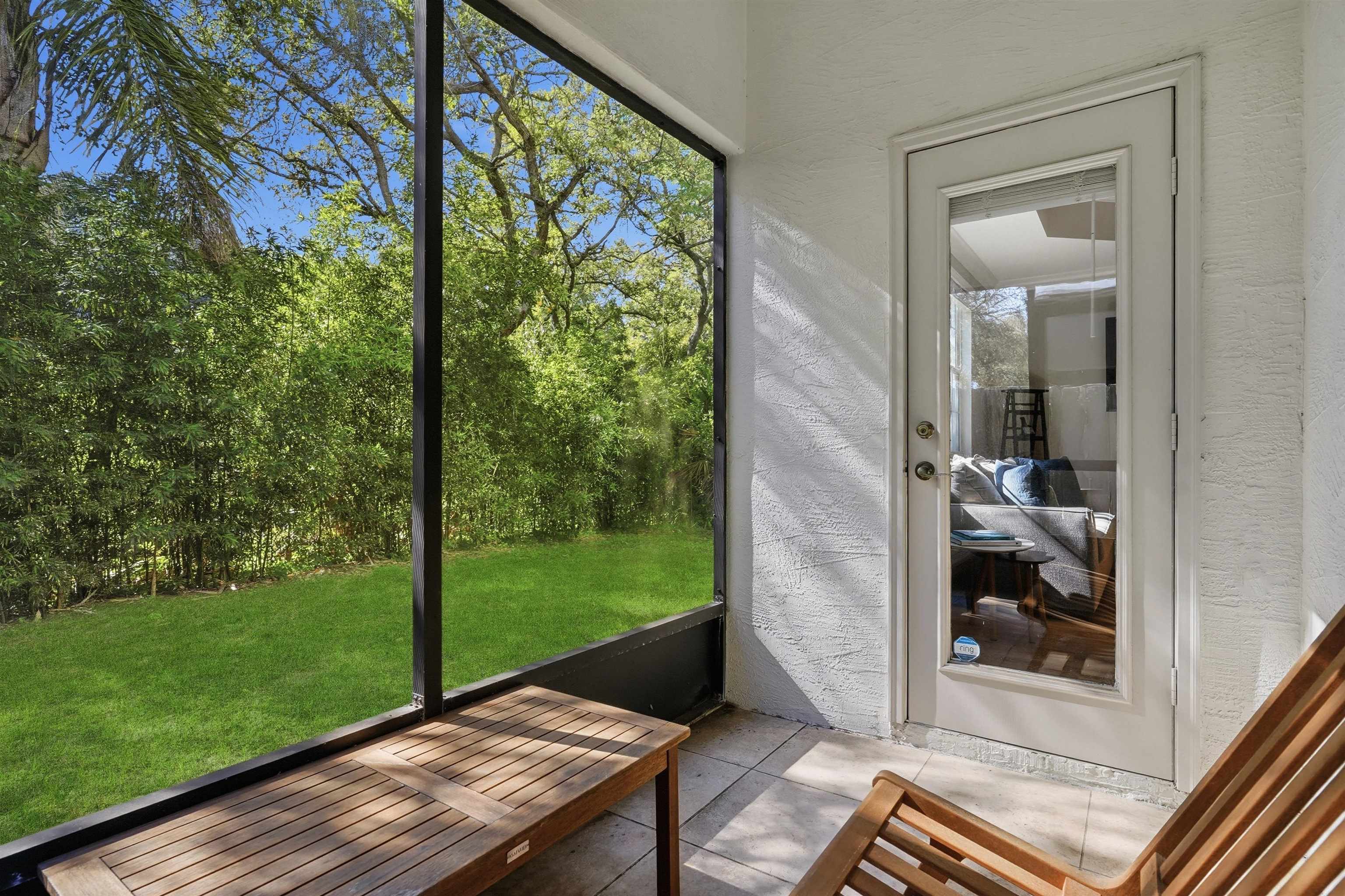 2 Lisbon Street St. Augustine, FL 32080 - Photo 30 of 39 a wooden bench sitting in front of a house