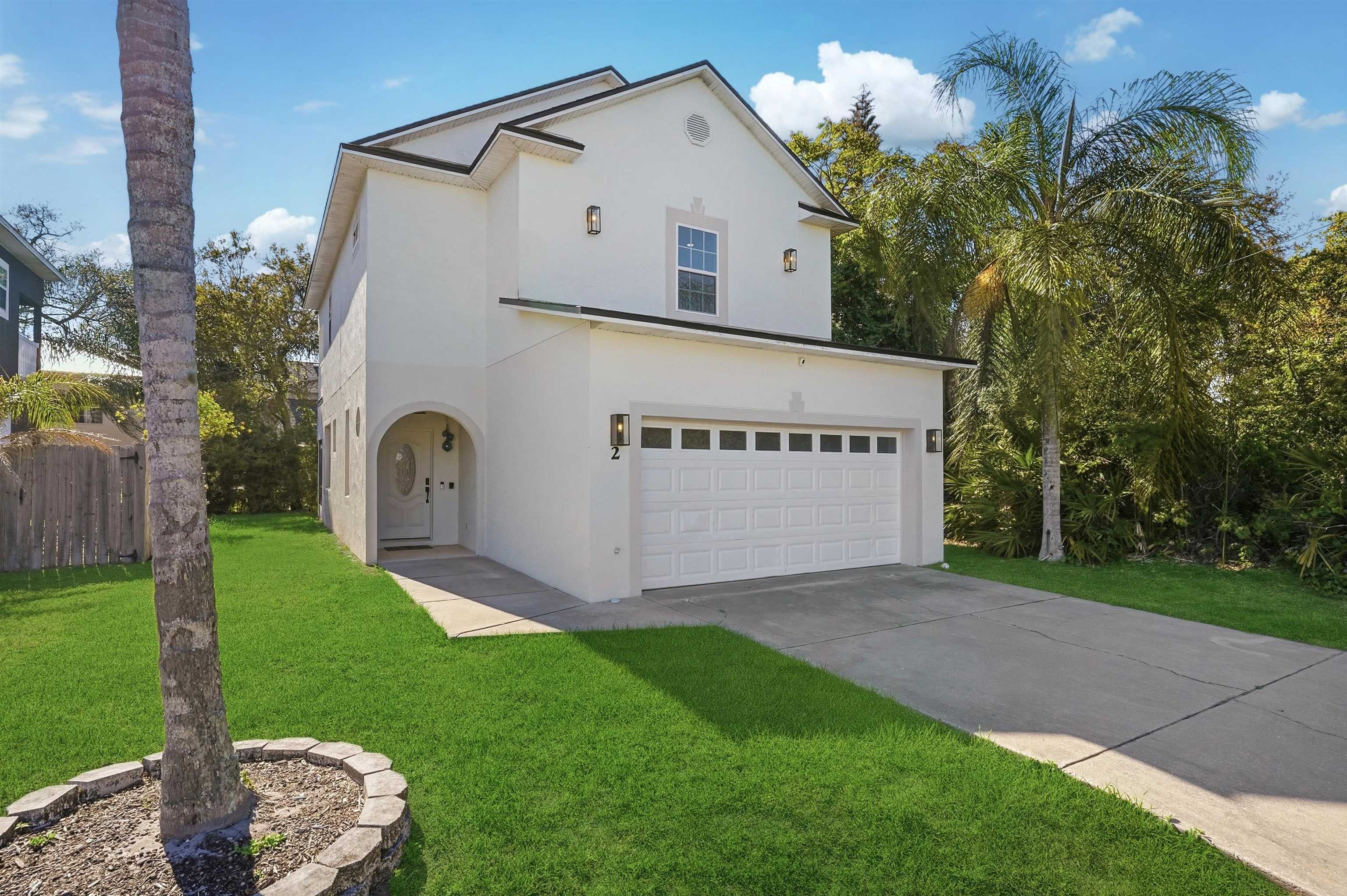 2 Lisbon Street St. Augustine, FL 32080 - Photo 6 of 39 a view of a back yard with a house and a garden