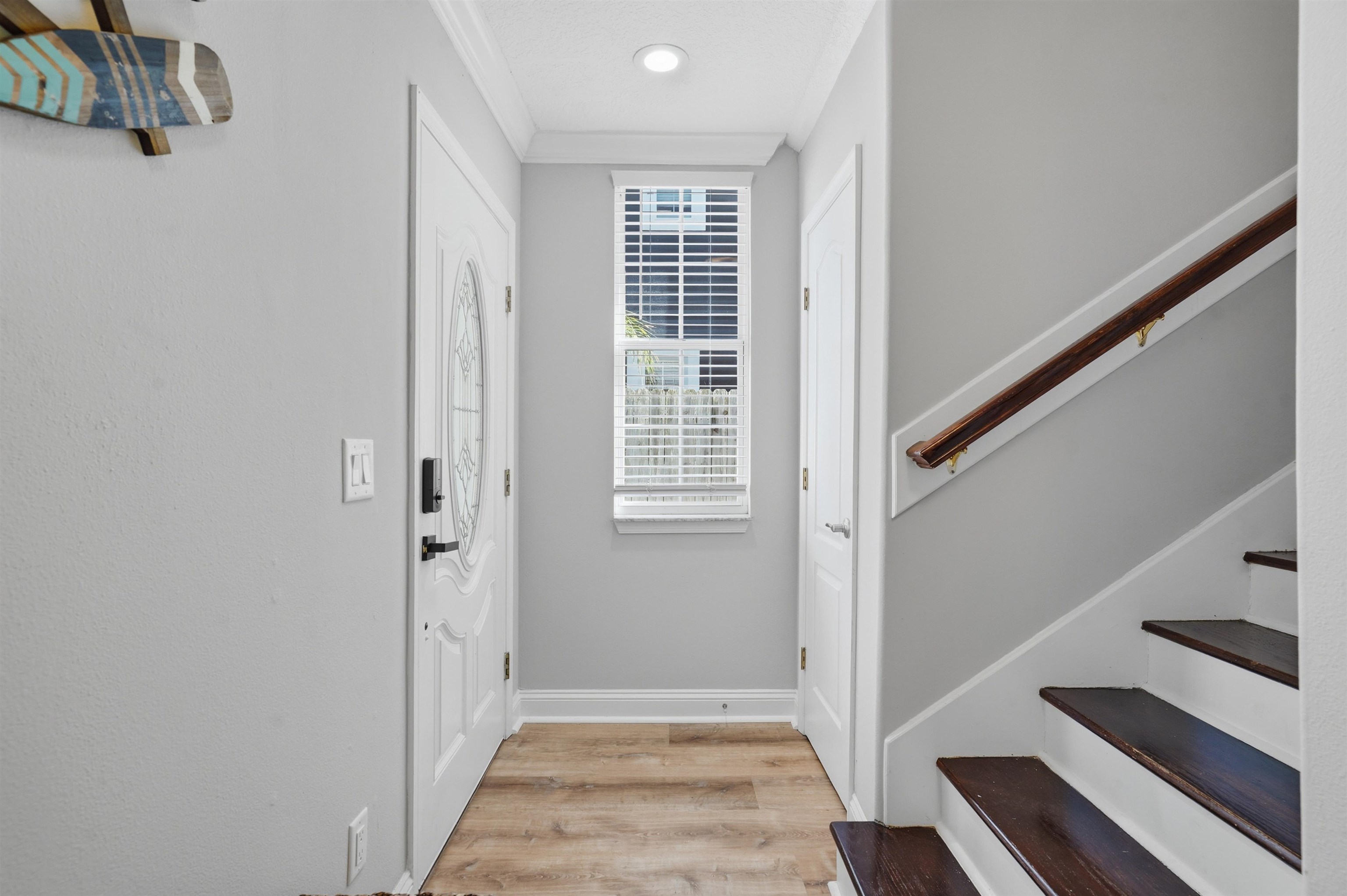 2 Lisbon Street St. Augustine, FL 32080 - Photo 8 of 39 a view of a hallway with wooden floor and staircase