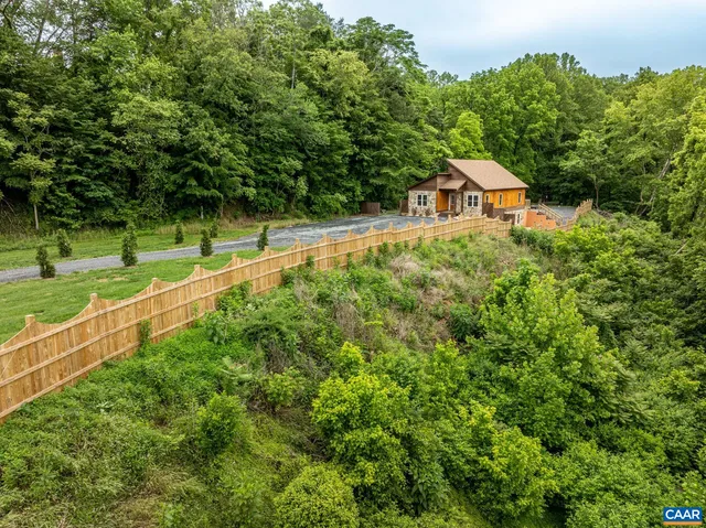 a kitchen with stainless steel appliances granite countertop a refrigerator sink and white cabinets