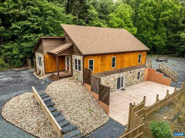 a aerial view of a house with more windows and barbeque oven