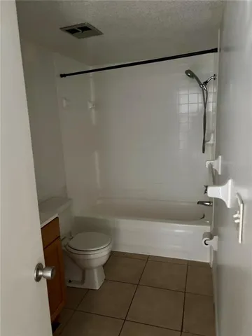 a bathroom with a shower and a toilet