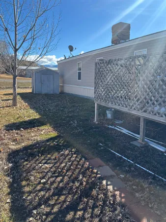 a view of a backyard of the house