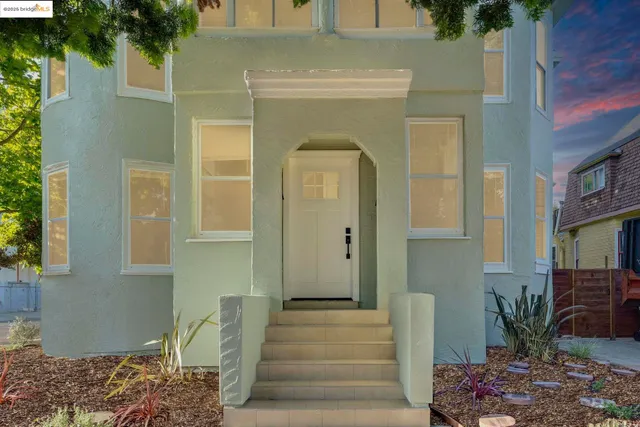 a front view of a house with garden