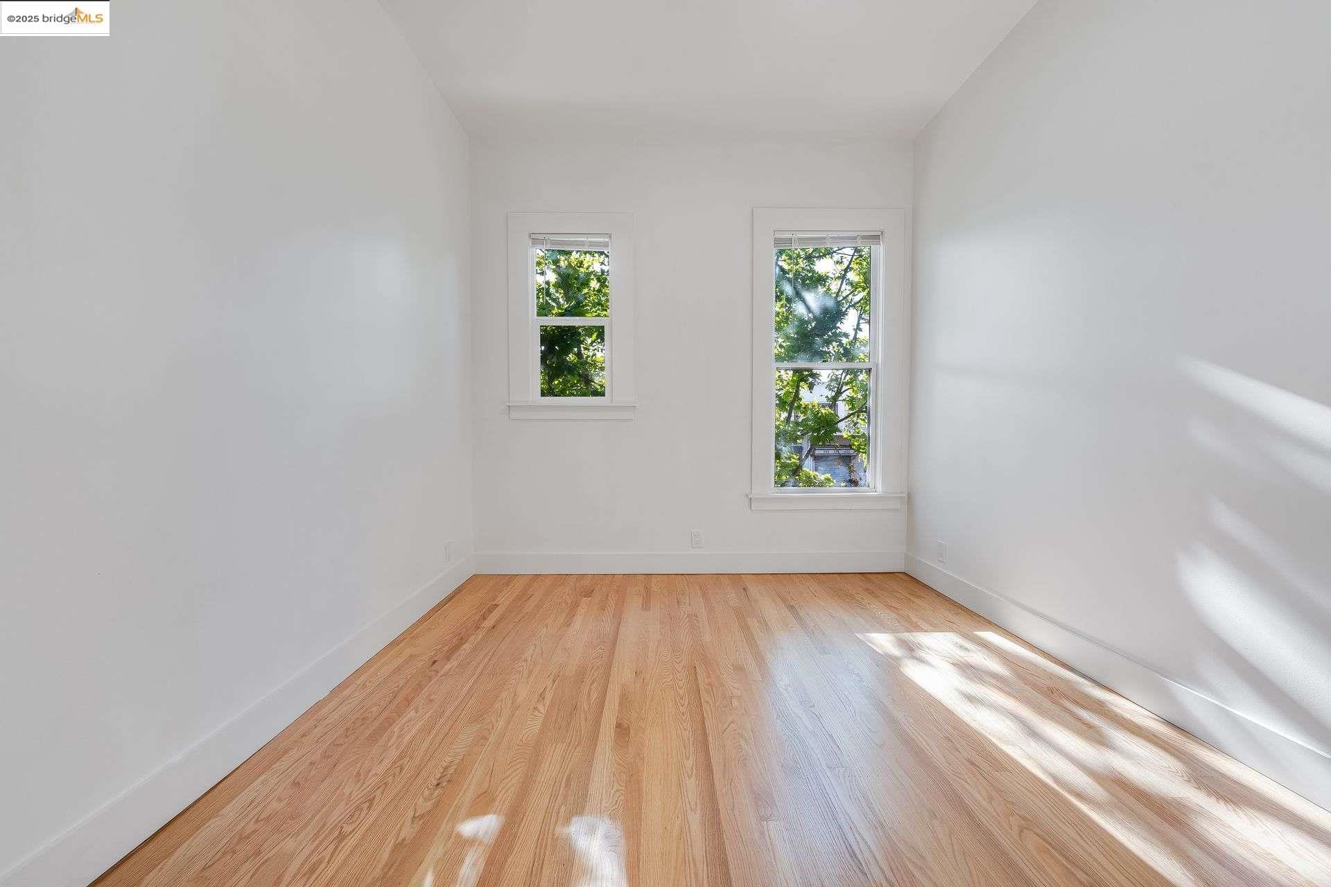 1238 12th Street Oakland, CA 94607 - Photo 14 of 55 a view of an empty room and window