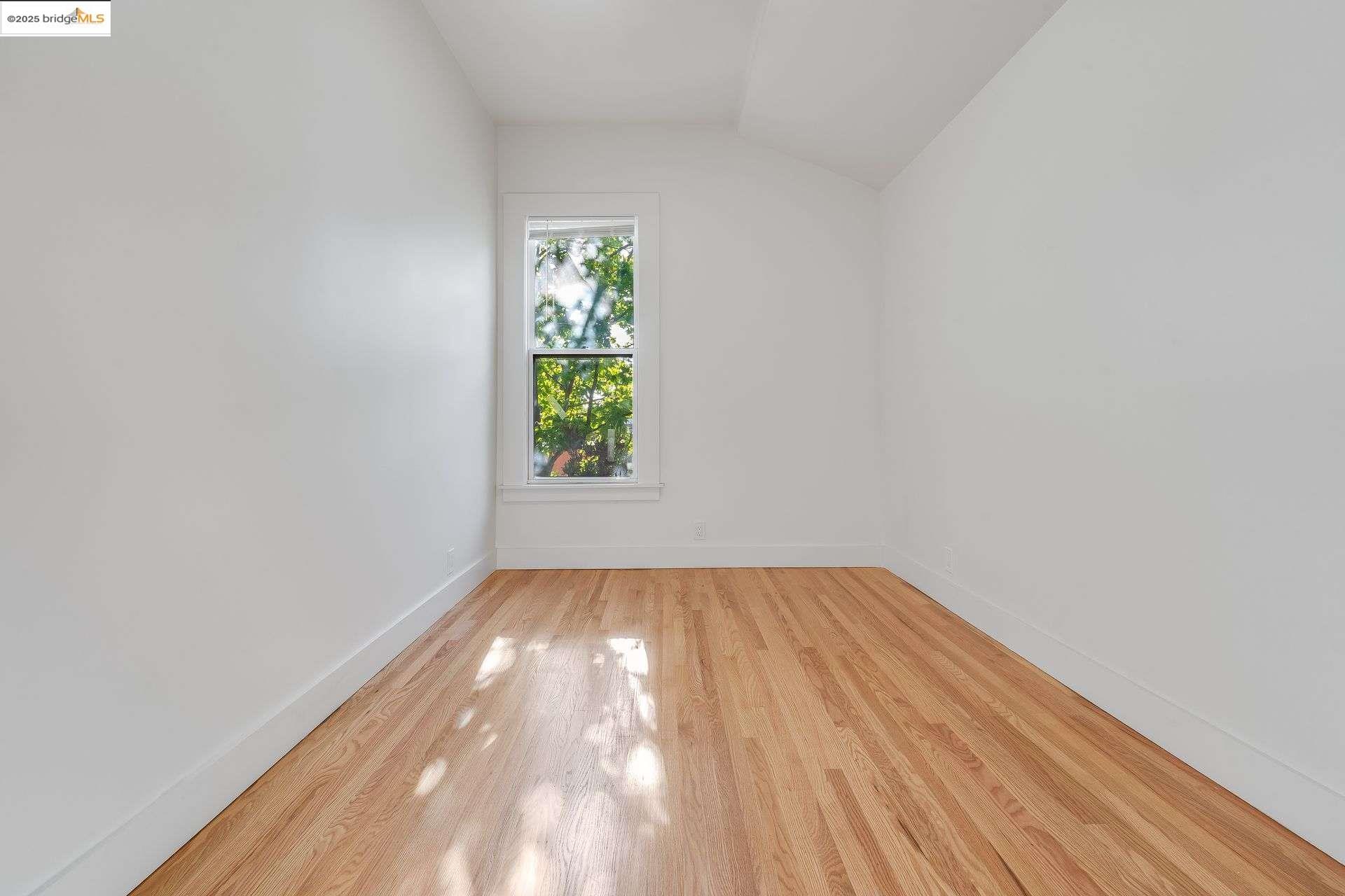 1238 12th Street Oakland, CA 94607 - Photo 18 of 55 a view of an empty room and window