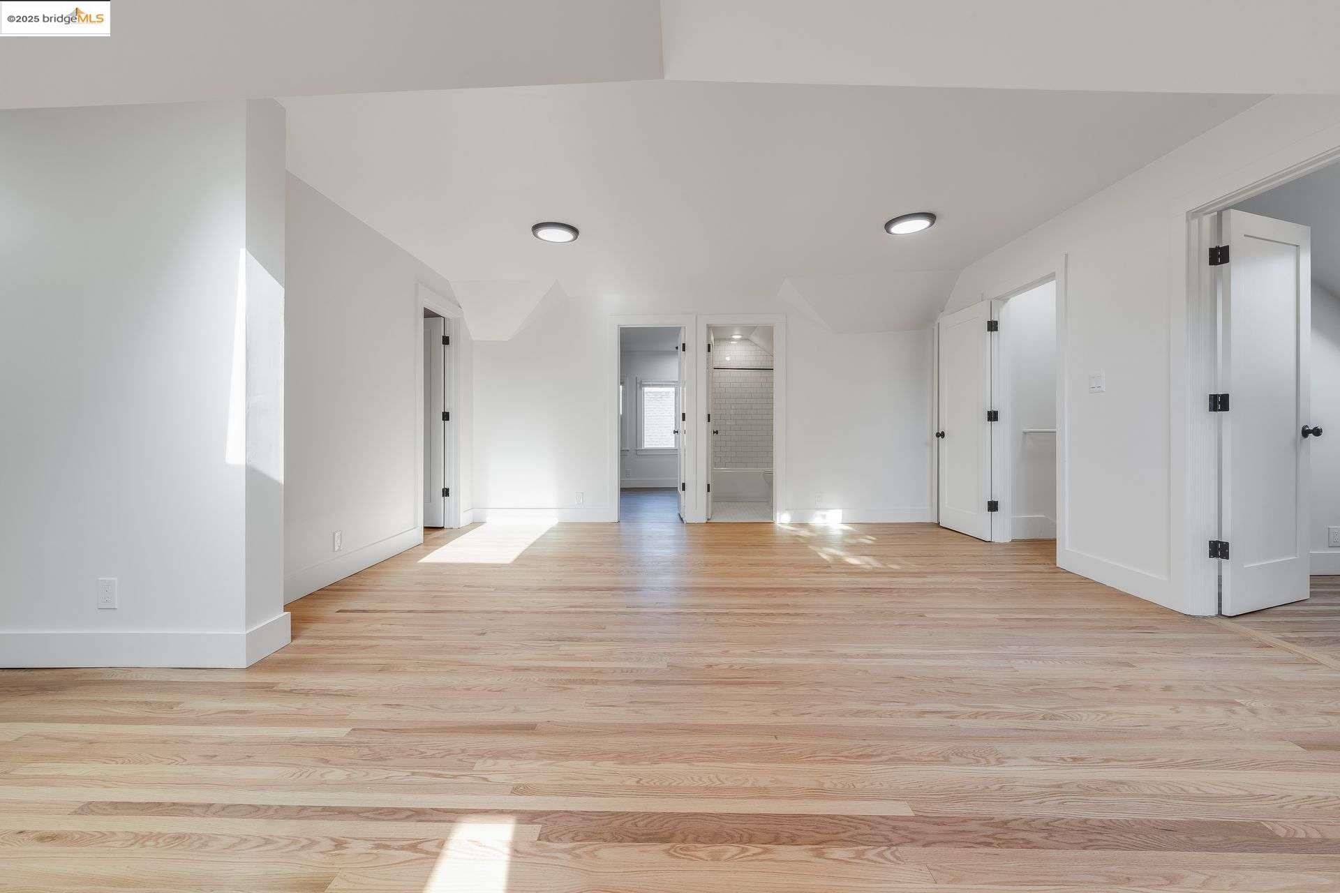 1238 12th Street Oakland, CA 94607 - Photo 23 of 55 a view of empty room with wooden floor