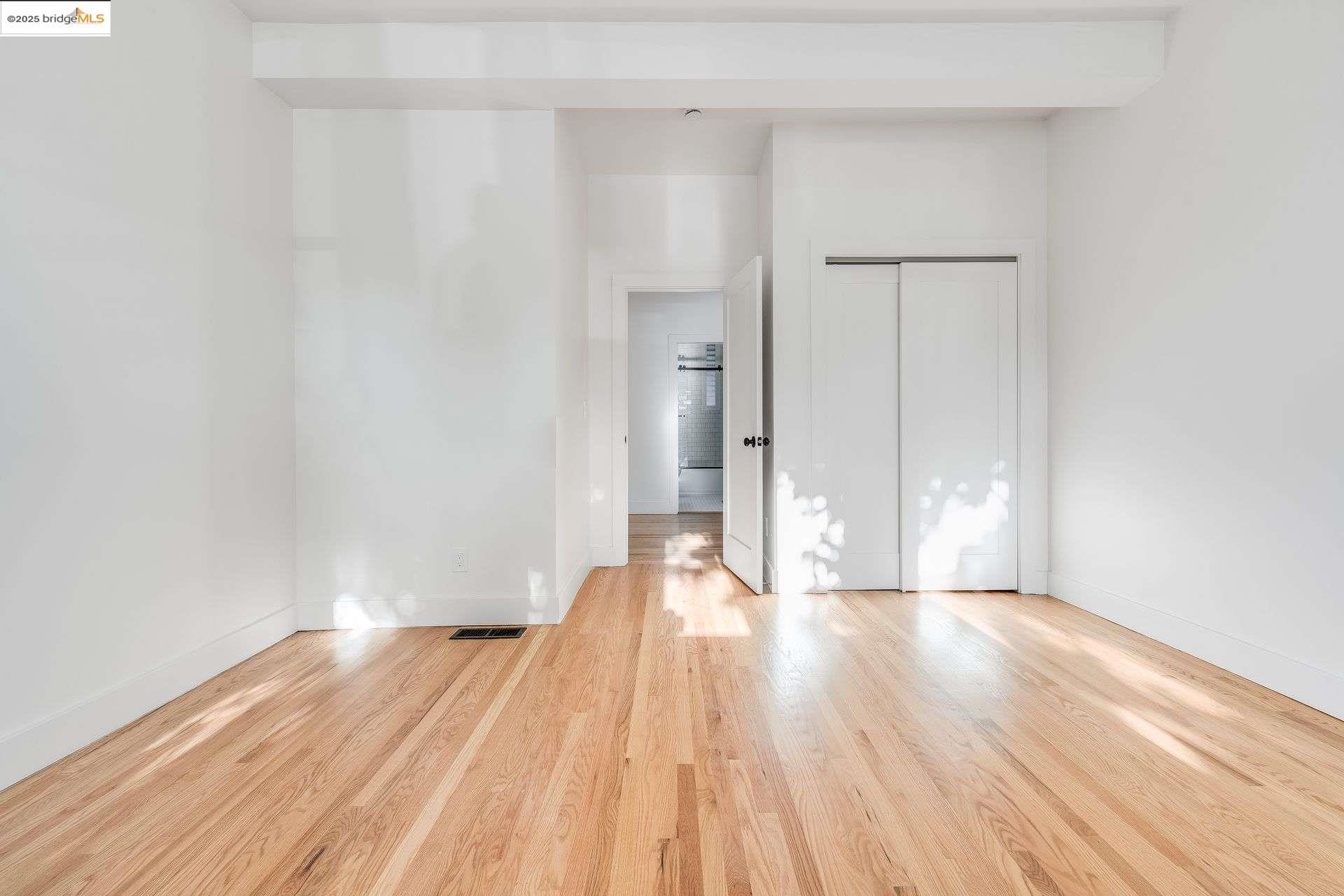 1238 12th Street Oakland, CA 94607 - Photo 42 of 55 a view of a big room with wooden floor and a window