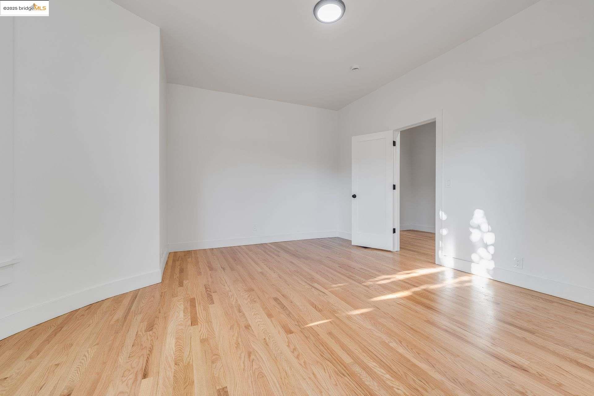 1238 12th Street Oakland, CA 94607 - Photo 52 of 55 a view of empty room with wooden floor