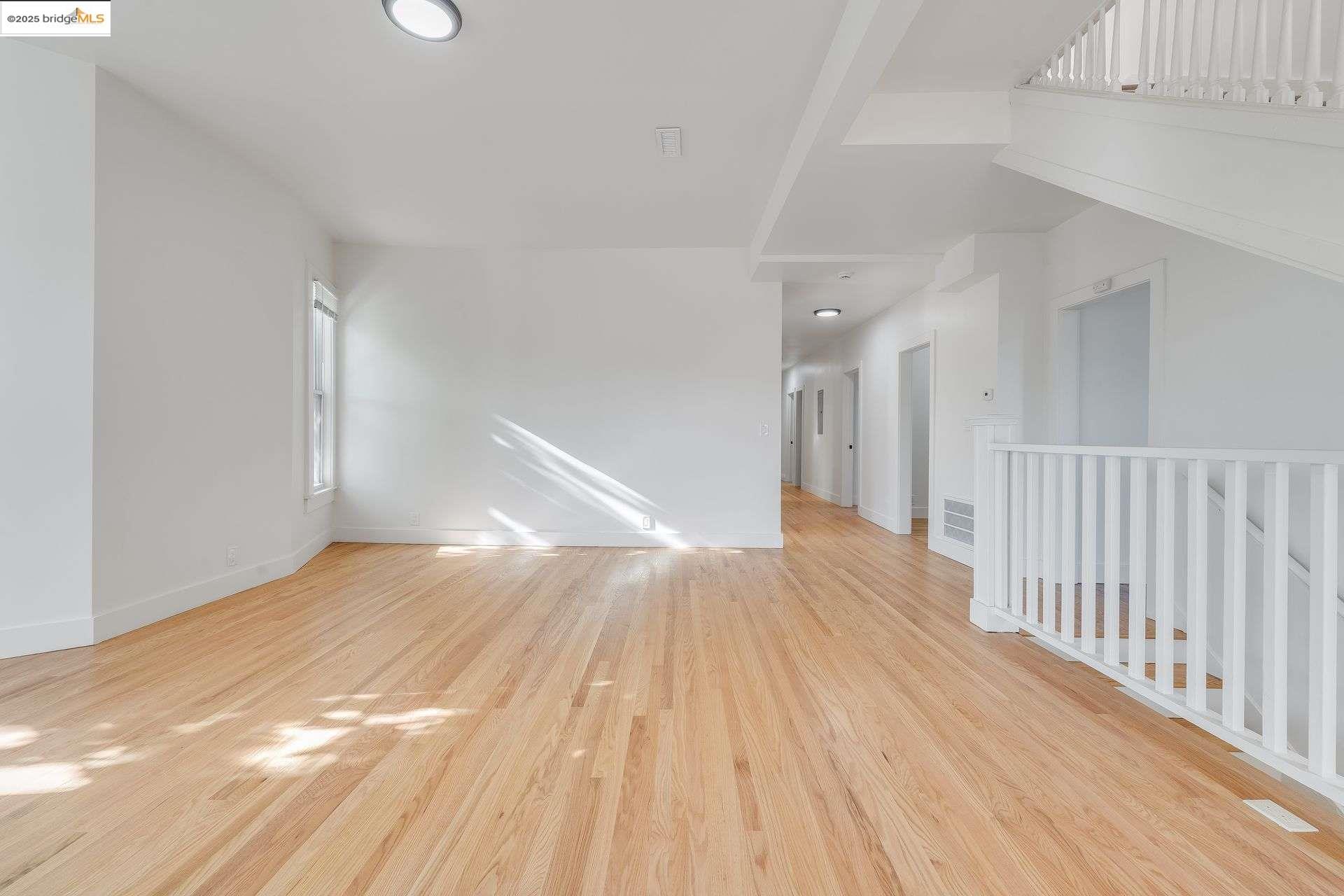 1238 12th Street Oakland, CA 94607 - Photo 6 of 55 a view of empty room with wooden floor