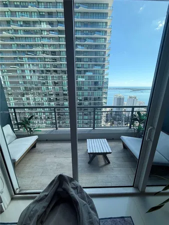 a view of roof deck with furniture