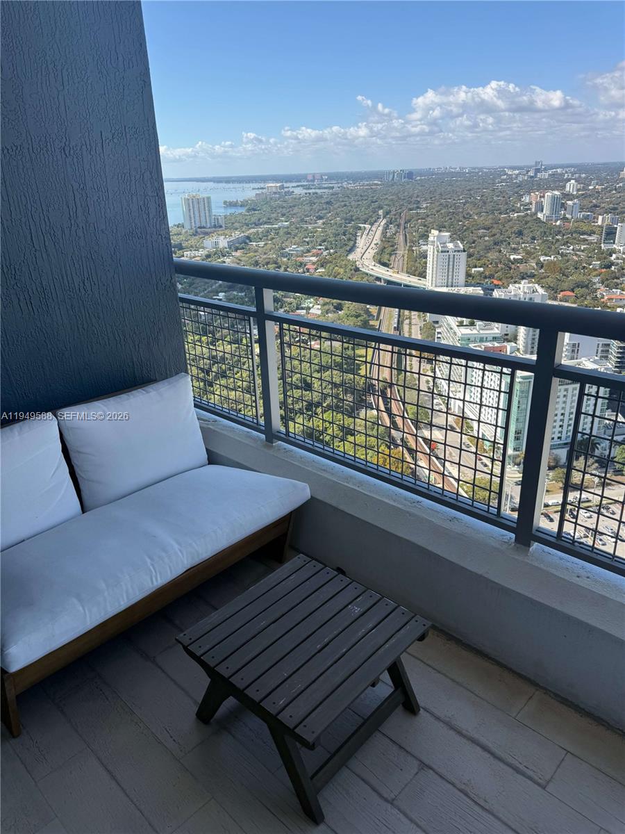 60 Southwest 13th Street, Unit 3808 Miami, FL 33130 - Photo 37 of 38 a view of a balcony with furniture