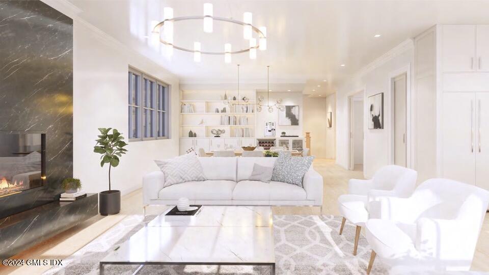 57 Locust Street, Unit A Greenwich, CT 06830 - Photo 10 of 24 a living room with furniture and a chandelier