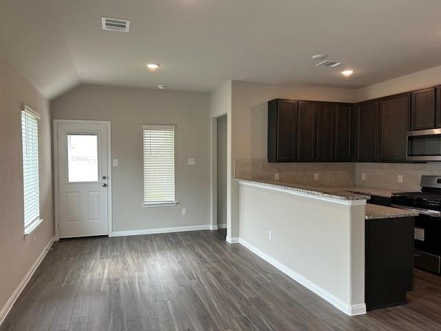 946 Luke Darrell Drive Rosharon, TX 77583 - Photo 20 of 22 a view of a kitchen with wooden floor and electronic appliances