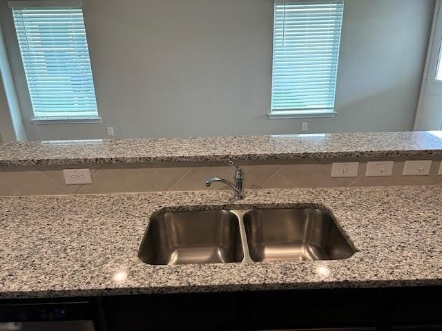 946 Luke Darrell Drive Rosharon, TX 77583 - Photo 3 of 22 a kitchen with a sink granite counter tops and a window