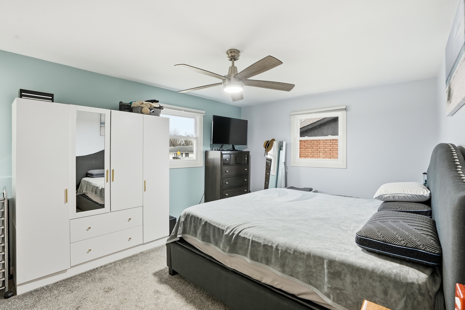 385 South Walnut Street Manteno, IL 60950 - Photo 11 of 27 a bedroom with a bed and a refrigerator