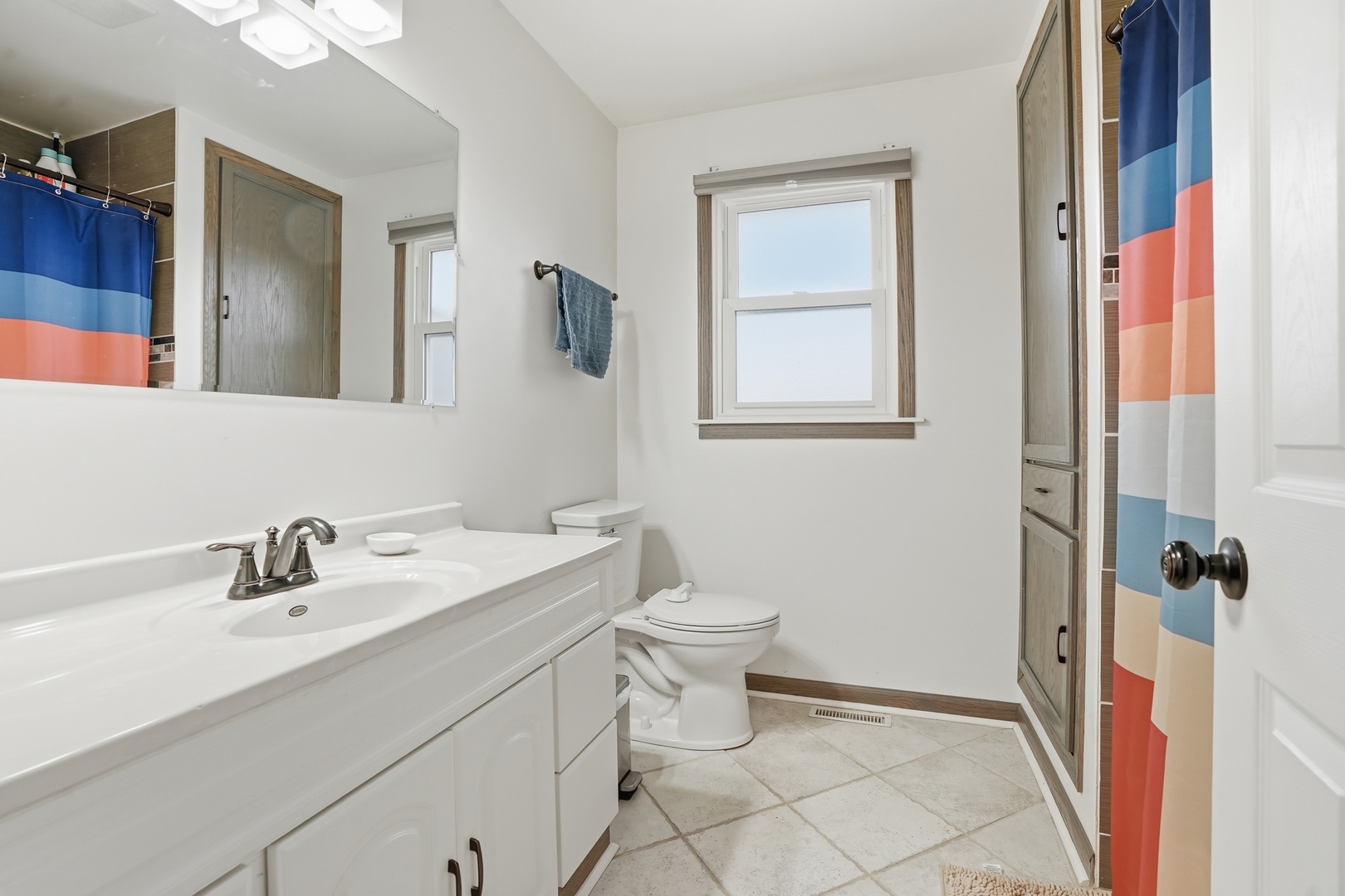 385 South Walnut Street Manteno, IL 60950 - Photo 15 of 27 a bathroom with a toilet sink and mirror
