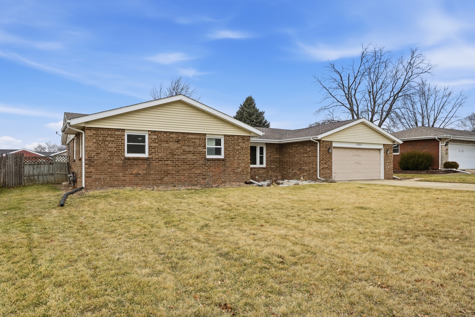 385 South Walnut Street Manteno, IL 60950 - Photo 2 of 27 a front view of a house with a yard