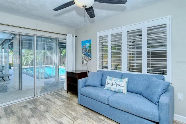 a white house that has a tree in front of it