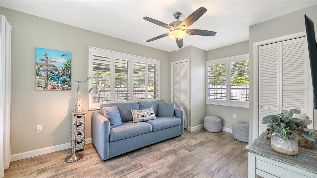 6758 South Lockwood Ridge Road Sarasota, FL 34231 - Photo 41 of 85 a living room with furniture and a large window