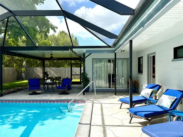 a table and chairs under an umbrella