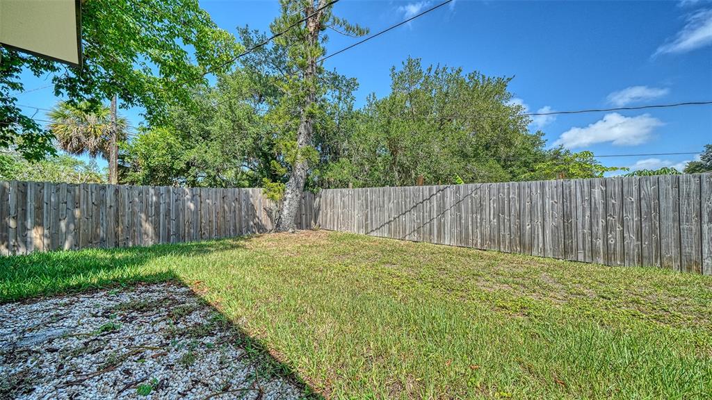 6758 South Lockwood Ridge Road Sarasota, FL 34231 - Photo 45 of 85 a view of outdoor space with wooden fence