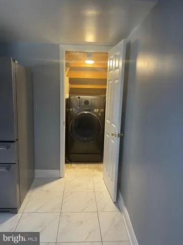 a bathroom with a mirror and a shower