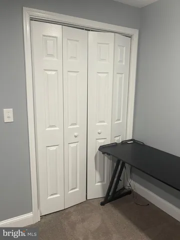 a view of a livingroom with table and chair