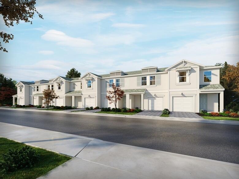 a front view of residential houses with street