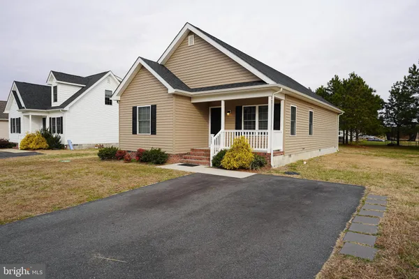 a front view of a house with yard