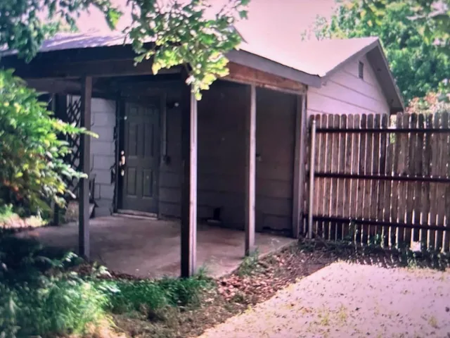 a view of a house with a tree