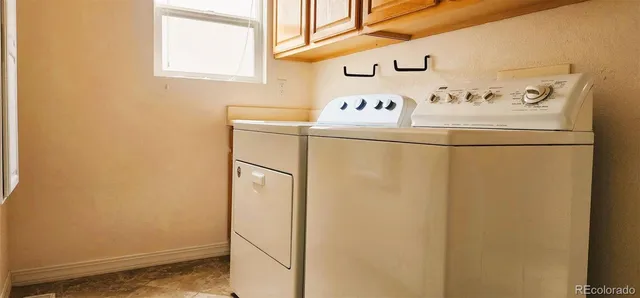 a white refrigerator freezer sitting inside of a kitchen