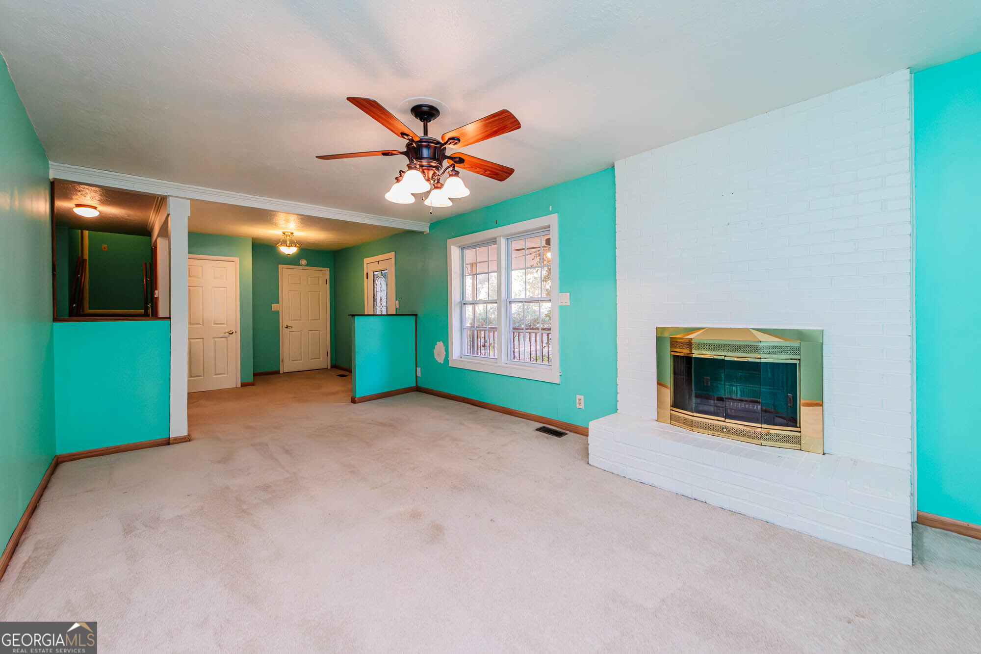 202 Brantley Road Warner Robins, GA 31093 - Photo 15 of 52 a view of a livingroom with a fireplace and window