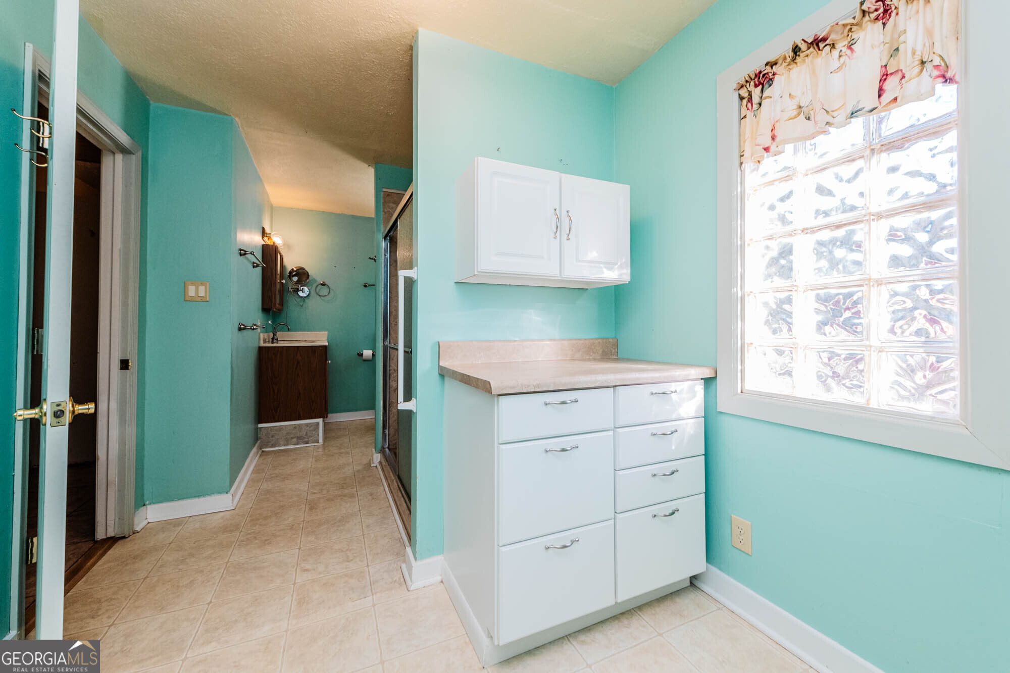 202 Brantley Road Warner Robins, GA 31093 - Photo 19 of 52 a utility room with cabinets washer and dryer