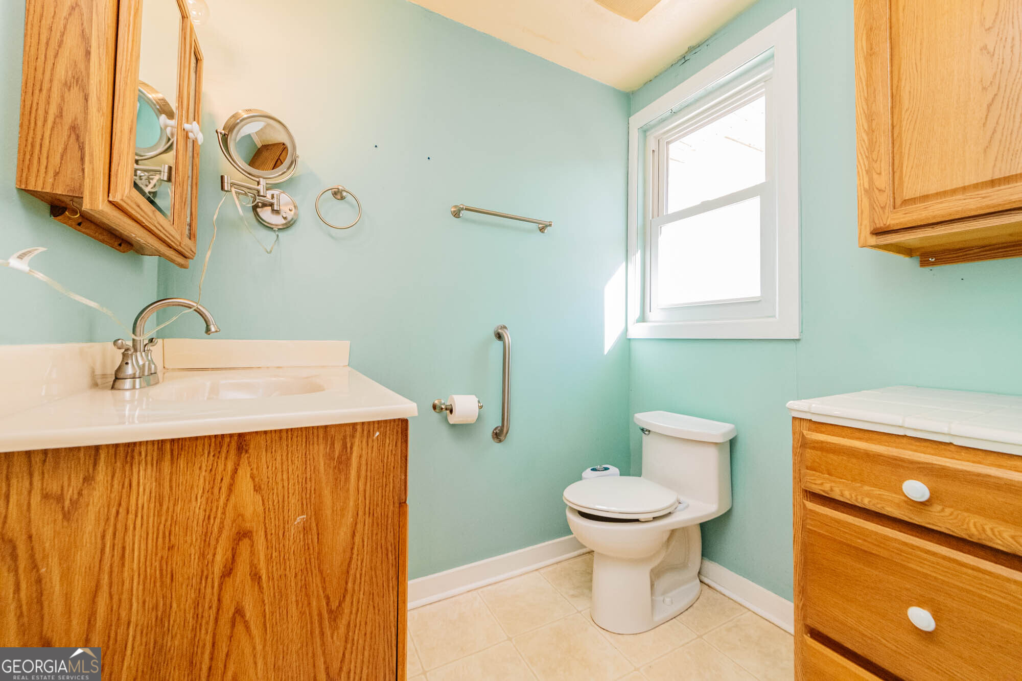 202 Brantley Road Warner Robins, GA 31093 - Photo 20 of 52 a bathroom with a toilet sink and mirror