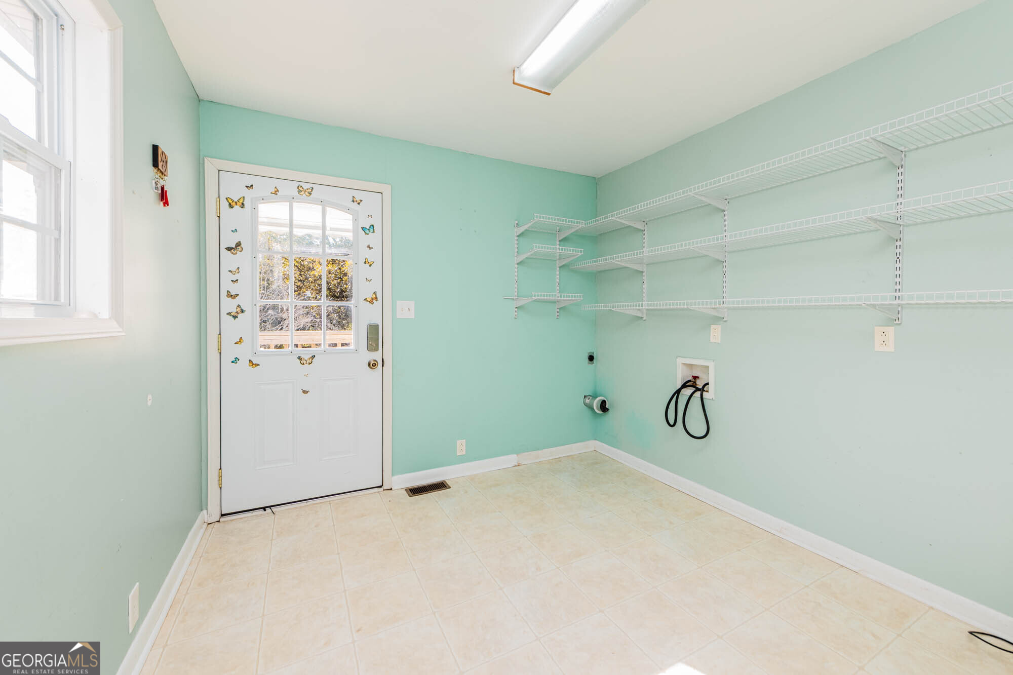 202 Brantley Road Warner Robins, GA 31093 - Photo 35 of 52 a view of a room with rack on the wall