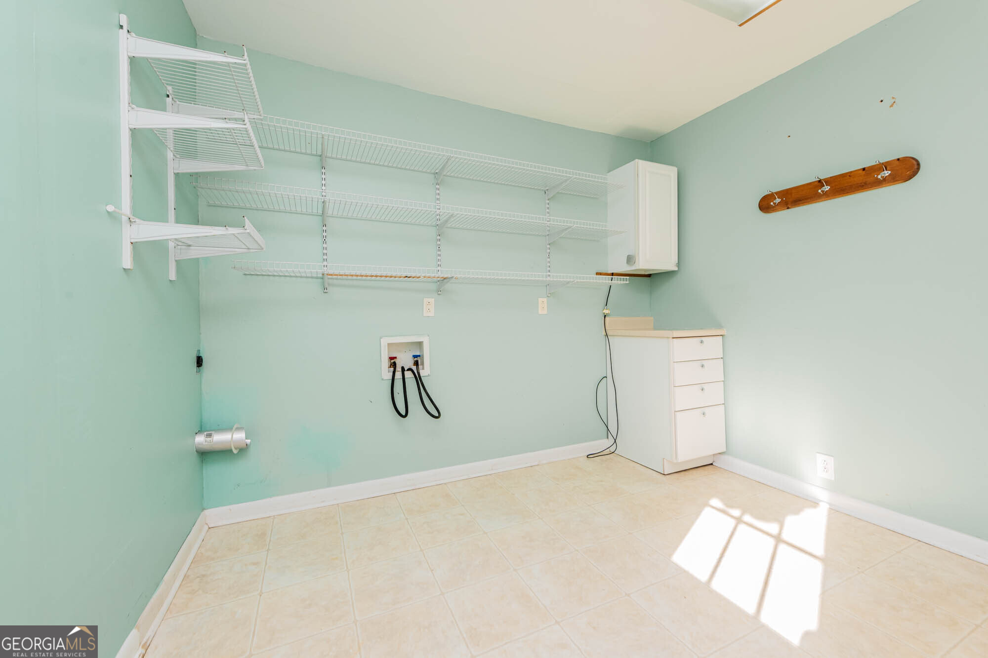 202 Brantley Road Warner Robins, GA 31093 - Photo 36 of 52 a view of a room with racks on the wall