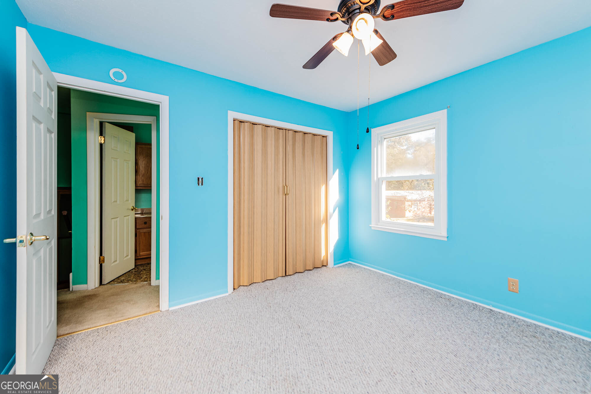 202 Brantley Road Warner Robins, GA 31093 - Photo 5 of 52 a view of a livingroom with a chandelier fan and windows