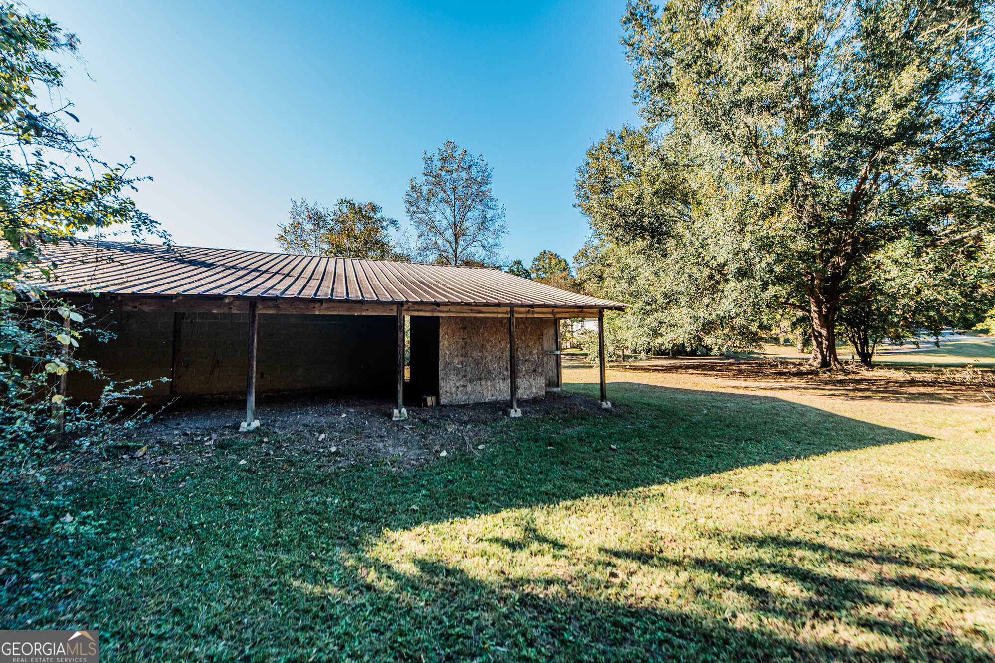 202 Brantley Road Warner Robins, GA 31093 - Photo 51 of 52 a view of a house with a yard