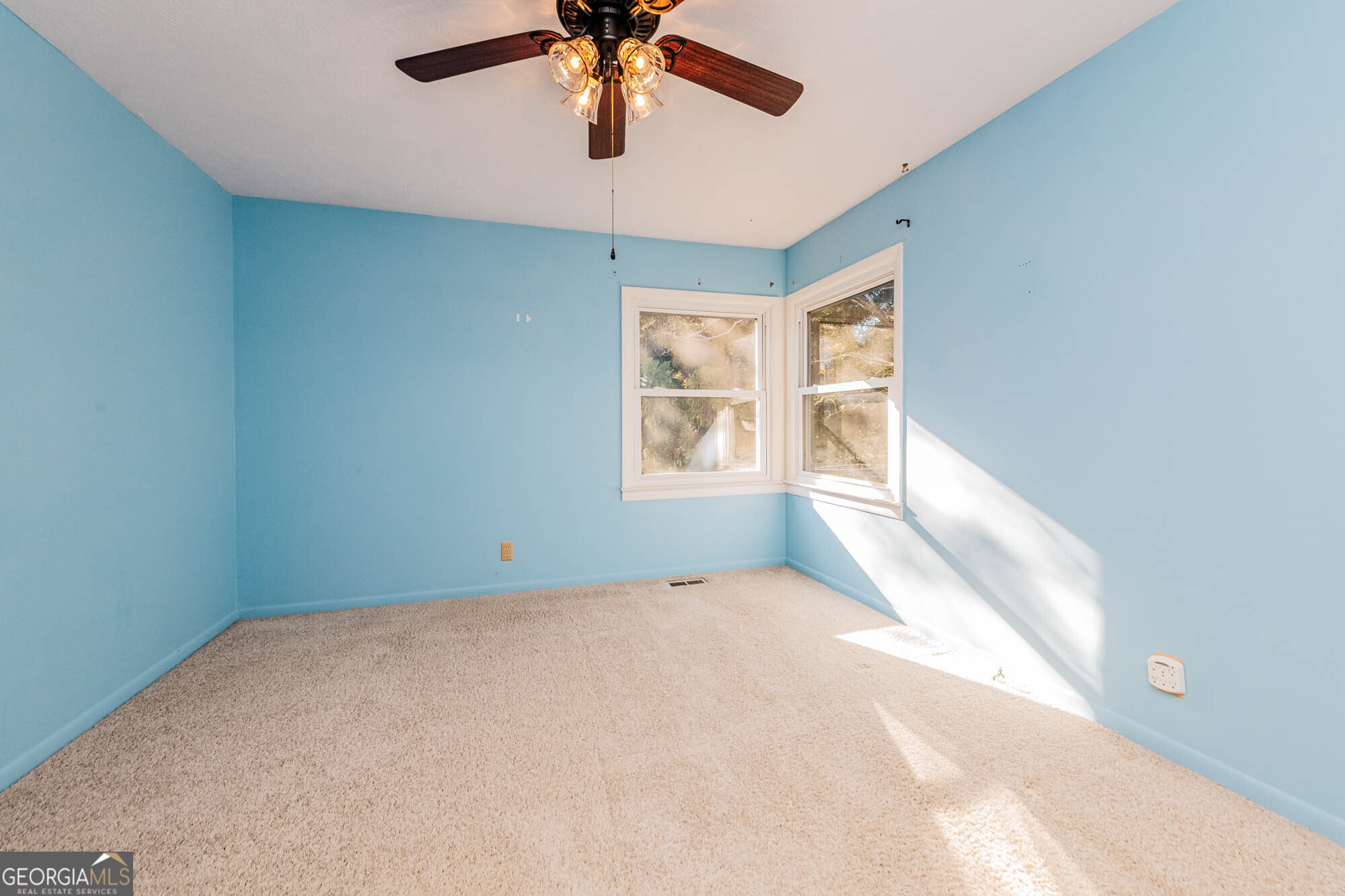 202 Brantley Road Warner Robins, GA 31093 - Photo 10 of 52 a view of an empty room with a window