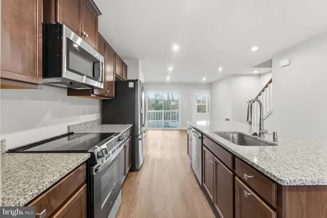 a view of a livingroom with furniture wooden floor and a window