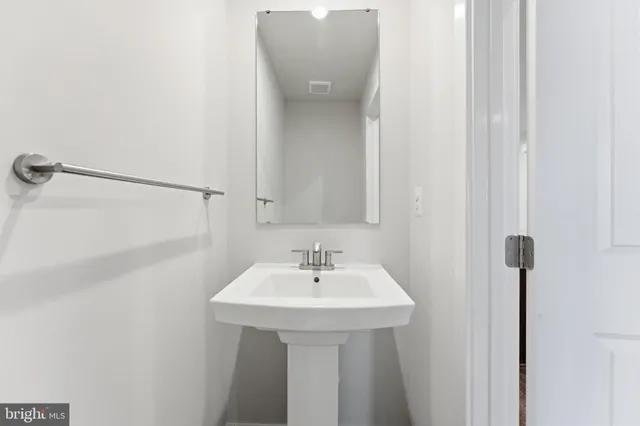 a view of an empty room and a window