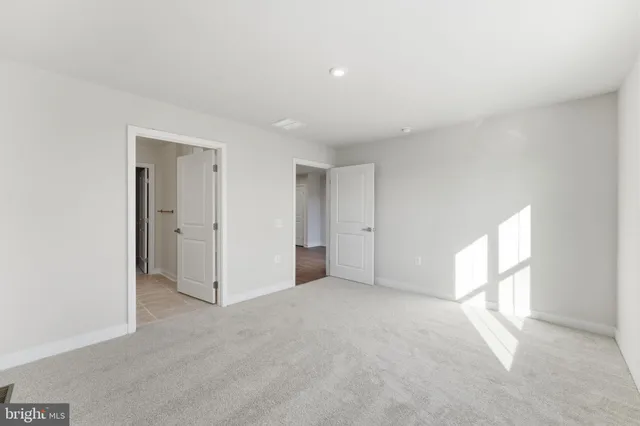 a bathroom with a sink and mirror with toilet