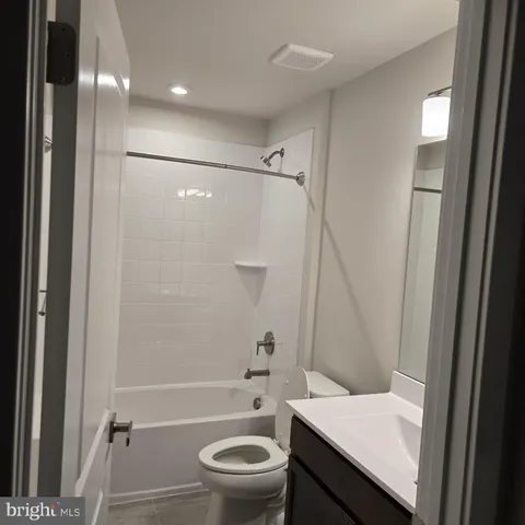 a bathroom with a toilet and a sink