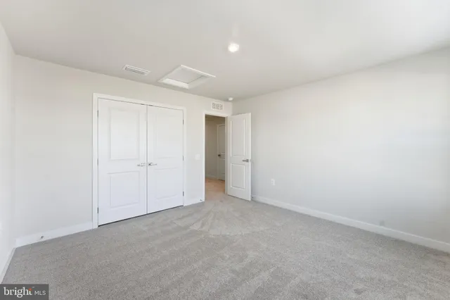 a view of an empty room with stairs