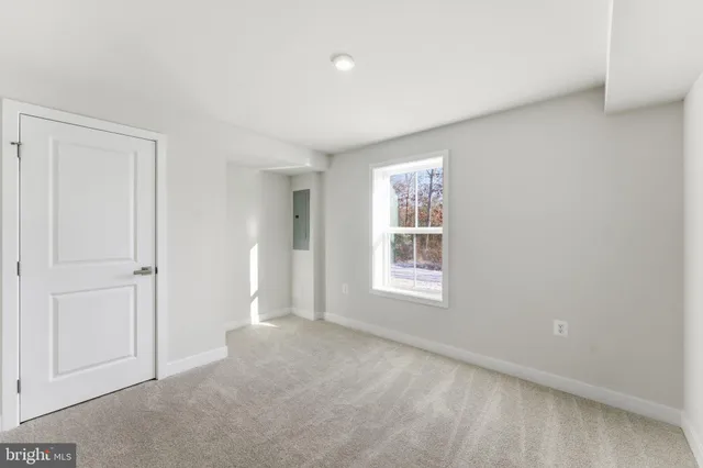 a view of an empty room with stairs