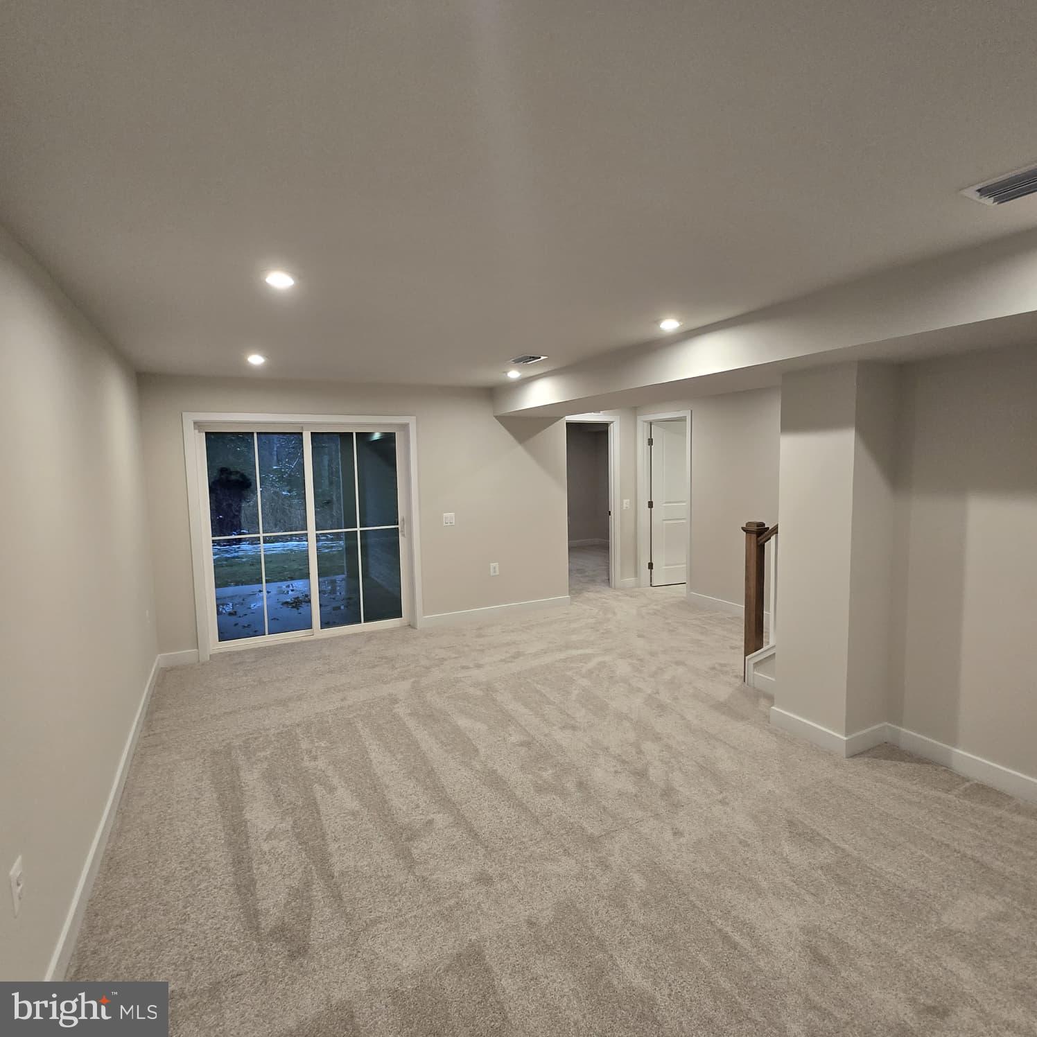 4218 Falkirk Place Fredericksburg, VA 22408 - Photo 5 of 36 a view of an empty room with a window